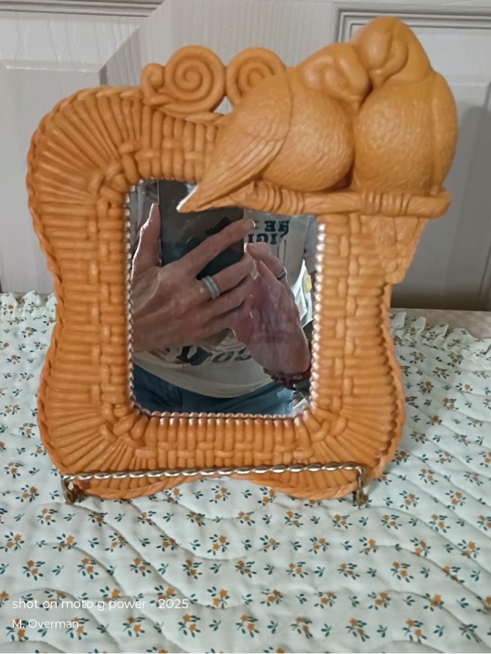 Vintage plastic wall mirror featuring lovebirds on a faux frame. 80s-90s era.